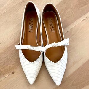 White Mary Jane shoe with bow detail and 1”heel. Size 7.5
